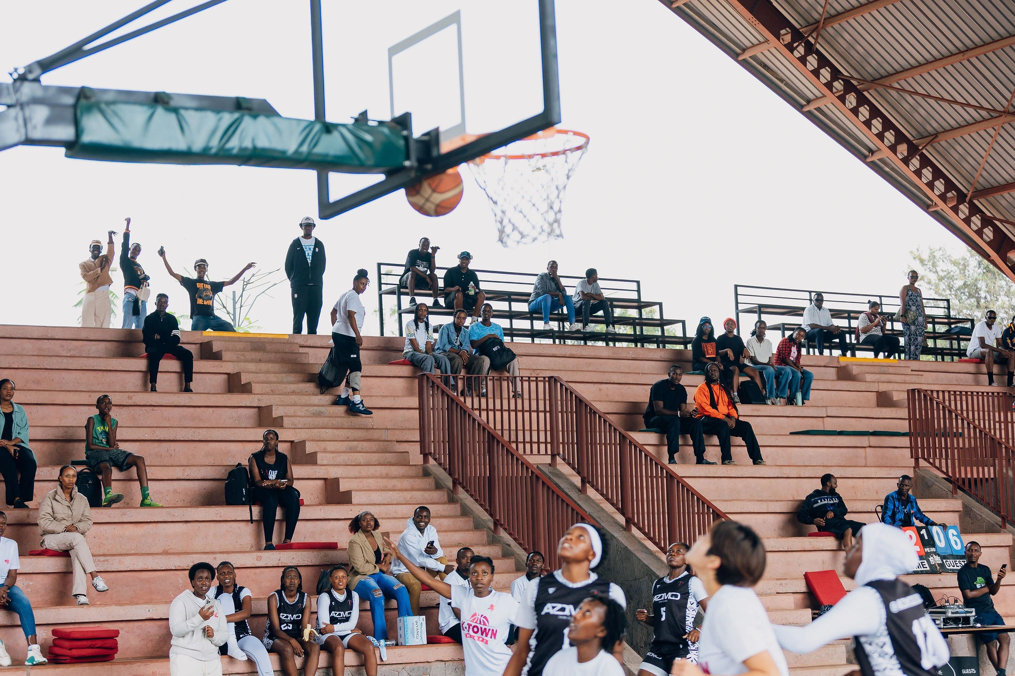 Women contesting a basketball shot on the court in supplied campaign photography